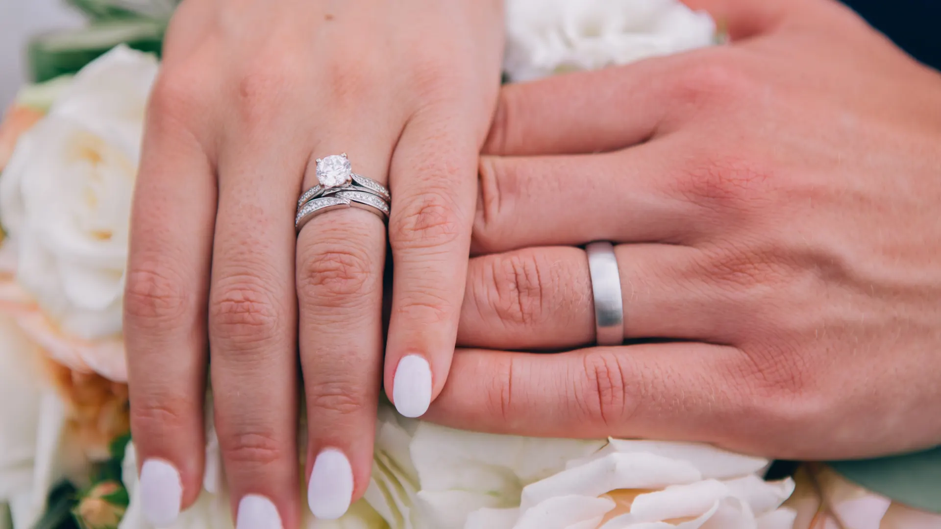 Couple’s hands engagement rings photoshoot